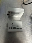 Set Of 2 Battery Packs LP-E5 For Canon Camera And Charger. Fixed Price $25.00.
