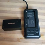 Hitachi VM-AC80A Adapter Power Charger W/duracell DR13 Battery Tested. Fixed Price $45.00.